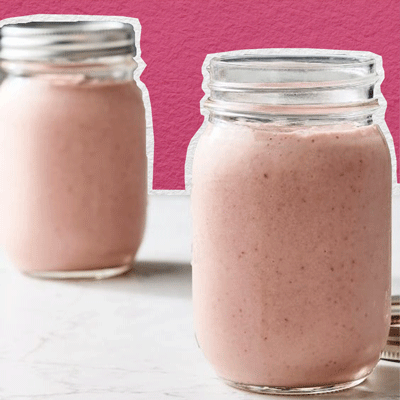 Image of two peanut butter and jelly smoothies in mason jars