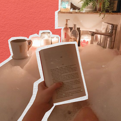 An image of someone reading in a bath